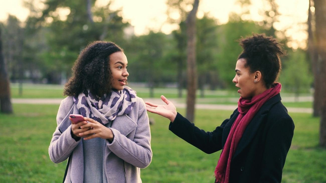 Two women in conversation in a park