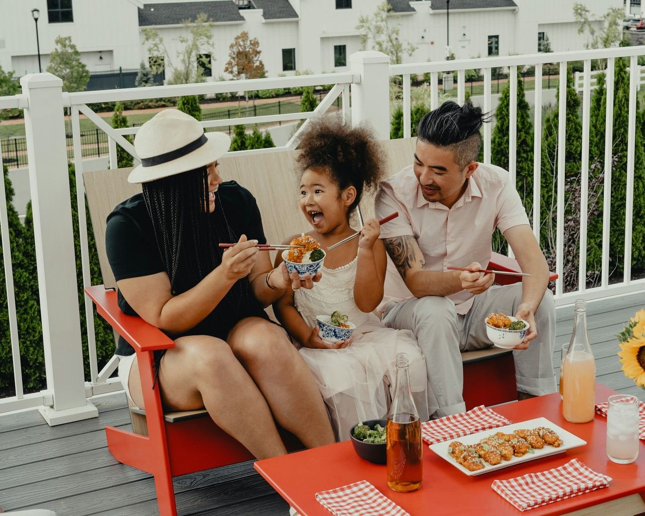 Friends laughing together on a front porch